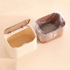 Cat litter waste bin outer shell open beside inner liner tray with plastic bag and litter