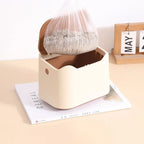 Removing full disposable liner bag from cat litter waste bin for easy disposal